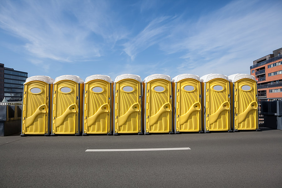 portable toilets beside the road