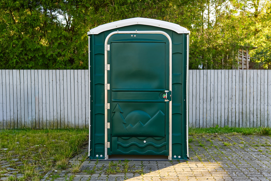portable toilet in the yard
