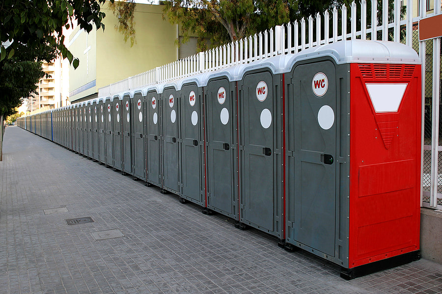 portable toilets beside the fence